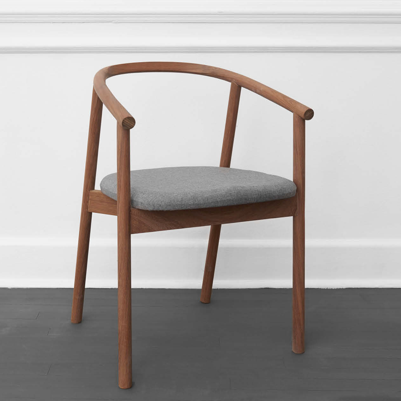 HARDWOOD CHAIR BY JAMES MUDGE. The Hardwood Chair is a striking but comfortable contemporary dining chair design. The elegant scoop of the backrest and the shaped timber seat are offset by the crisp lines of the angled timber legs. 