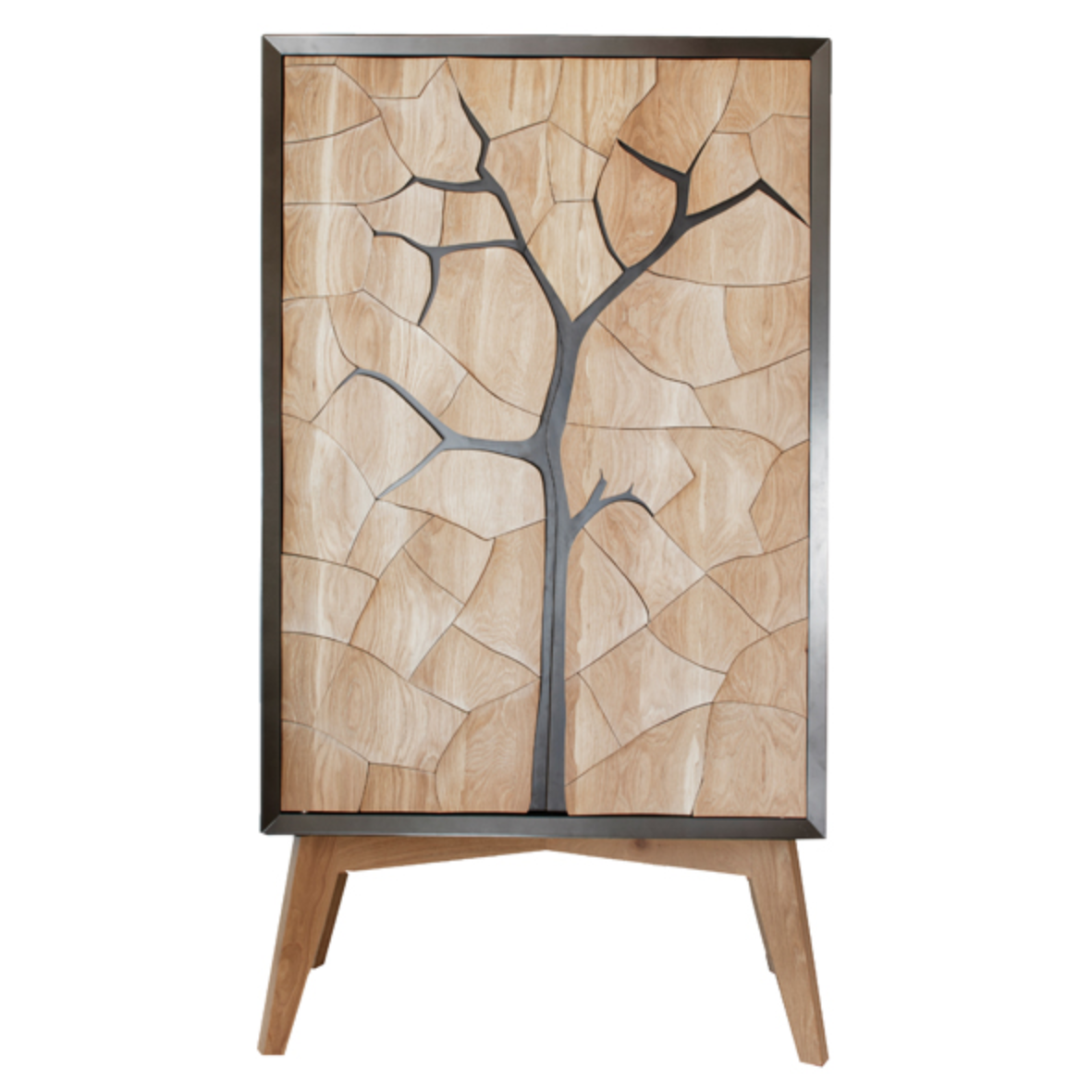 Mud Drinks Cabinet by Meyer Von Wielligh. Inspired by the cracked mud plates found on the dry riverbed of Sossusvlei in Namibia, Abrie’s homeland. The metal or timber surround of the cabinet is cleverly extended into a silhouette of the branches of a tree that is also recessed handle grips for the doors. 