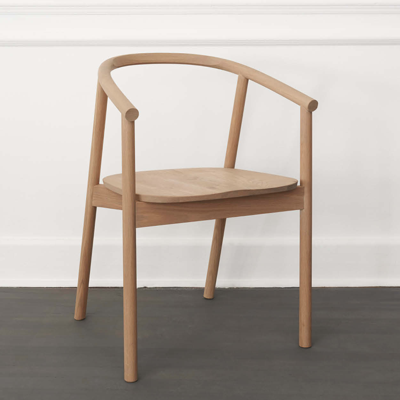 HARDWOOD CHAIR BY JAMES MUDGE. The Hardwood Chair is a striking but comfortable contemporary dining chair design. The elegant scoop of the backrest and the shaped timber seat are offset by the crisp lines of the angled timber legs. 